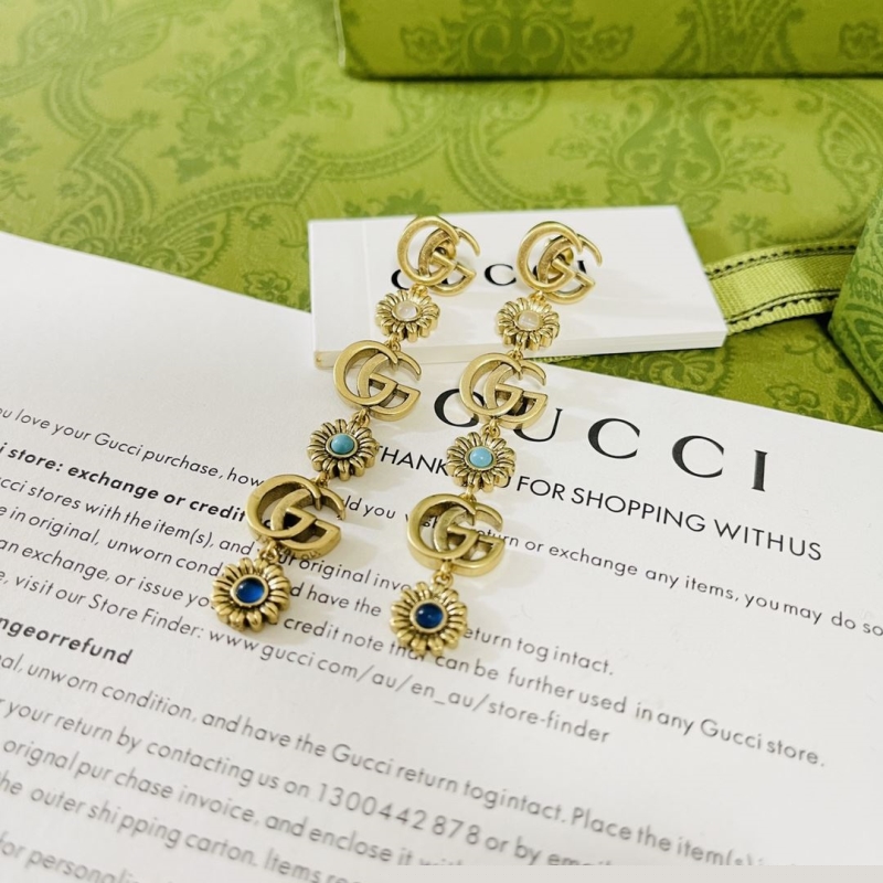 G*u*i earrings